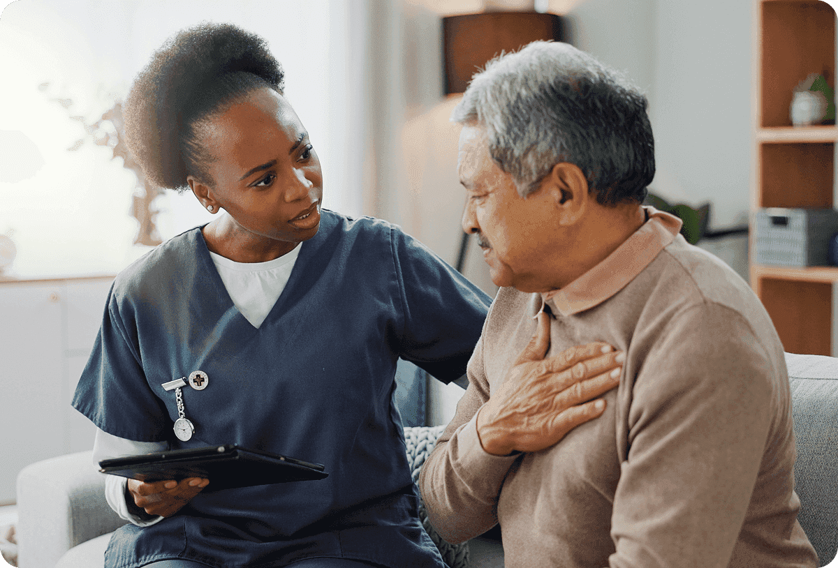 Image of a caregiver explaining health tips to a senior and their family