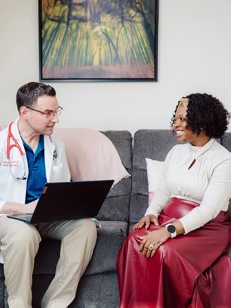 Doctor discussing health with a patient during a primary care visit