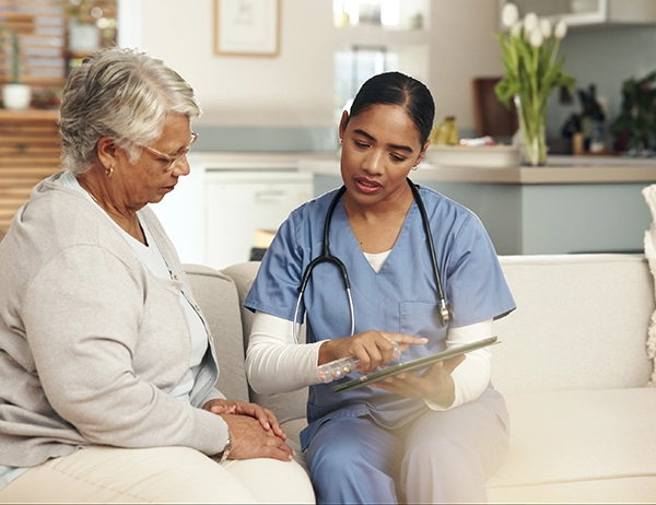 Doctor consulting senior patient on recovery plan