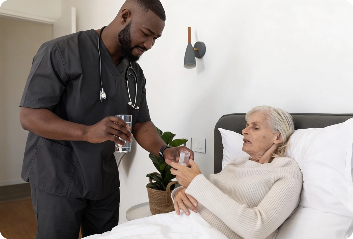 A male nurse providing bedside care and medication to an elderly female resident in her room.